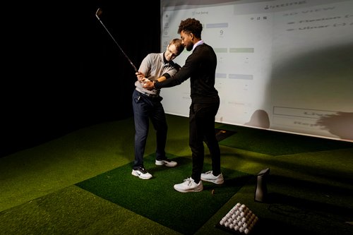 Coach Working With Student