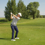 golf player ready for golf shot with driver